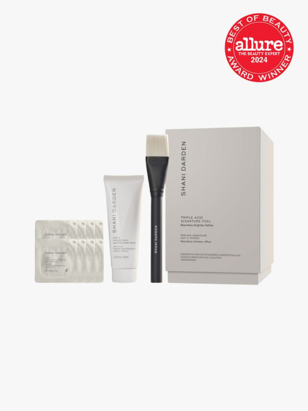facial peel system with brush applicator product and additional sachets next to branded box packaging on light gray background with red and white 2024 allure best of beauty seal